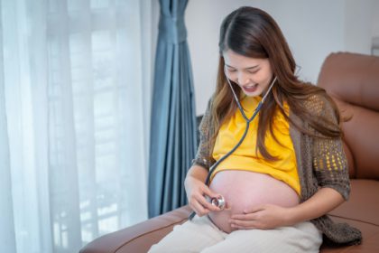 pregnant woman Listen to your baby's voice with stethoscope